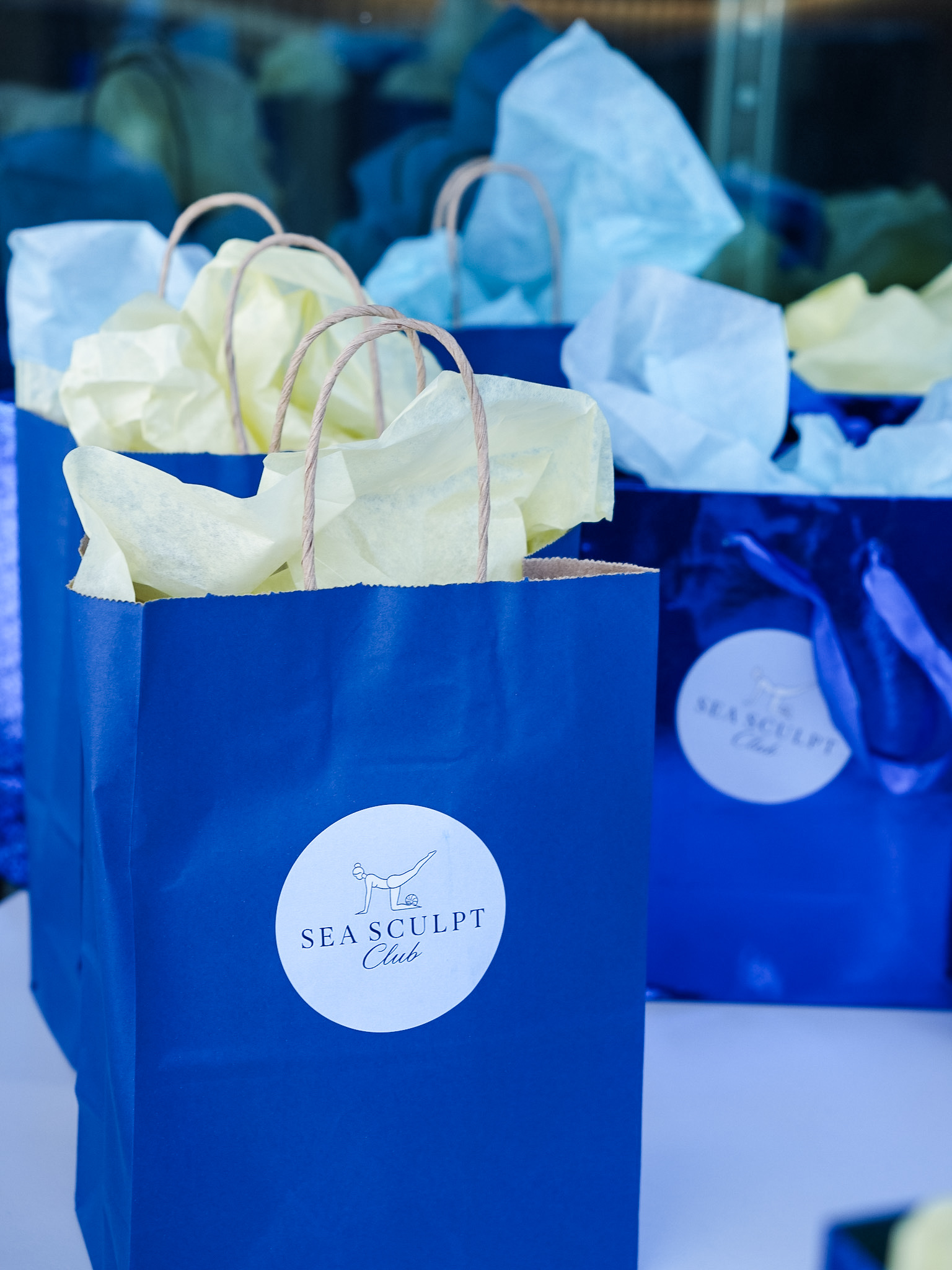 Sea Sculpt Club branded gift bags at Wave Resort Poolside Pilates event
