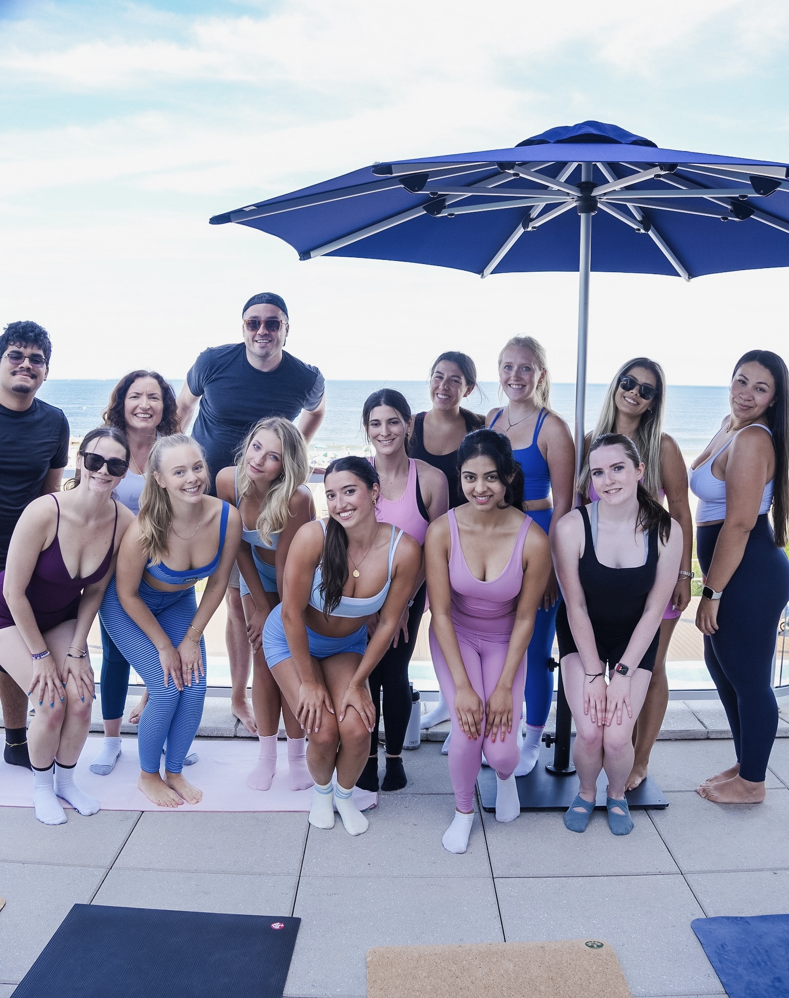 Sea Sculpt Club group photo at Wave Resort Poolside Pilates